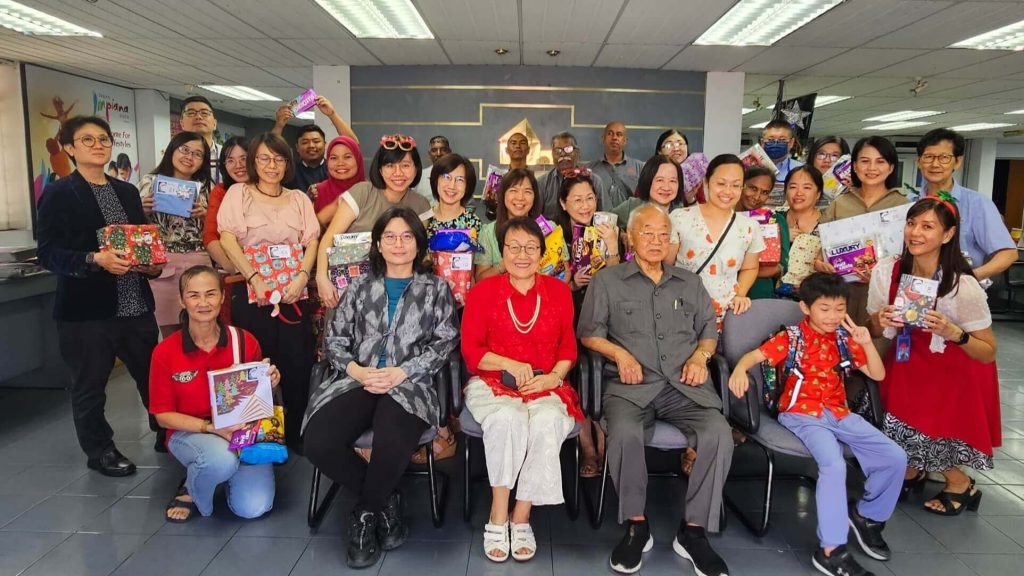 The team gathered in a group shot, capturing the festive atmosphere of the event.